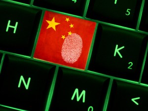Online crime scene with a finger print left on backlit keyboard with Chinese flag on it